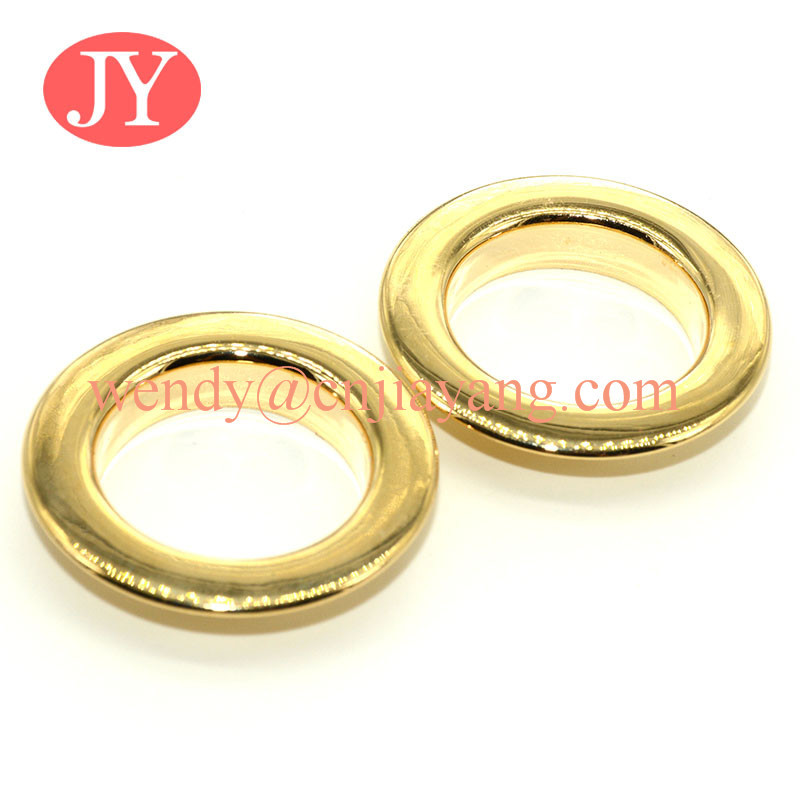 China Glossy gold 21x12x4.5mm Nickle free High quality brass metal shoe eyelets and grommet for clothing on sale