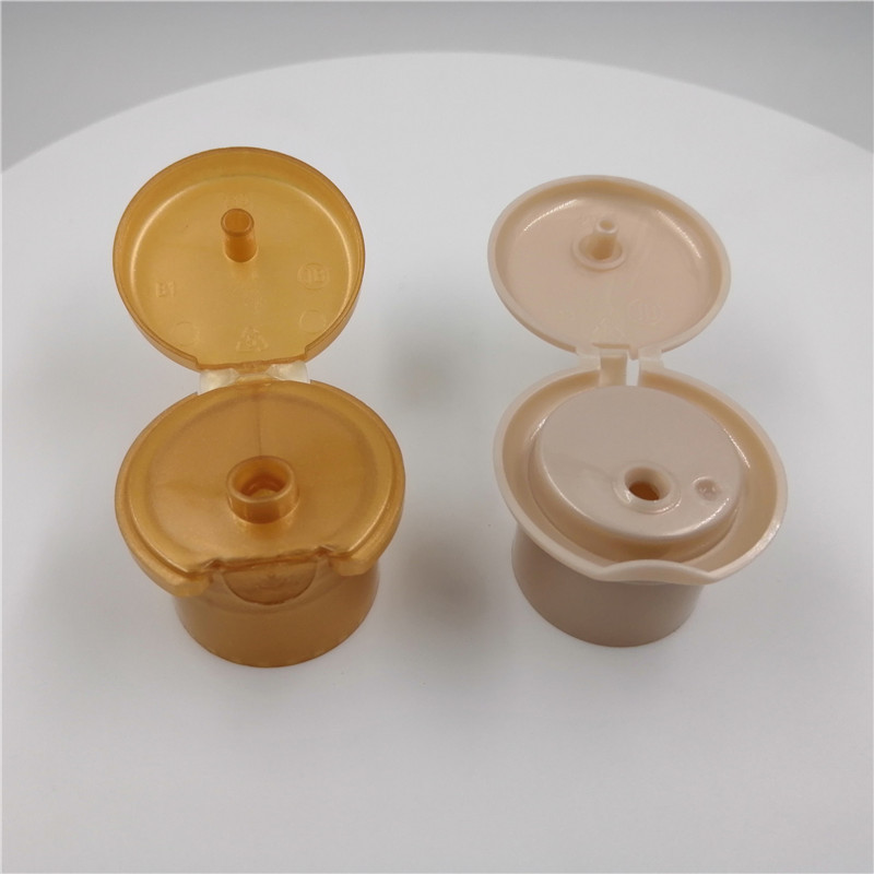 Quality Various Volume Cosmetic 28mm Plastic Bottle Flip Top Cap Round Shape for sale