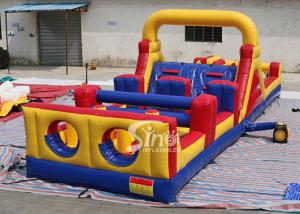 China 37' long outdoor commercial kids inflatable obstacle course with pillars and slides inside on sale