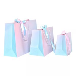 Quality Custom Logo Holographic Gift Paper Clothing Bags ISO Gradient Drawstring Paper Bag for sale