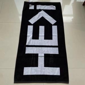 China 100% cotton thick warm soft terry customized design black white jacquard beach towel on sale