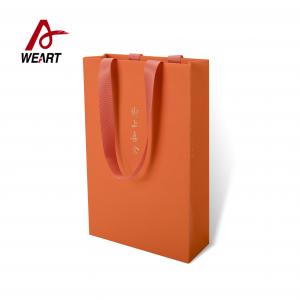 Quality Orange Color Fancy Paper Material Custom Printed Reusable Shopping Bags for sale